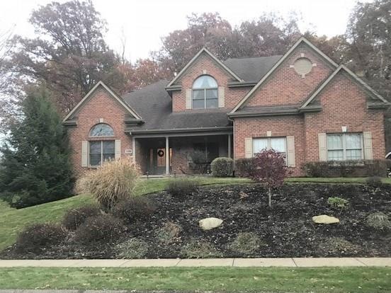 Attractive Traditional brick home with varied roof
