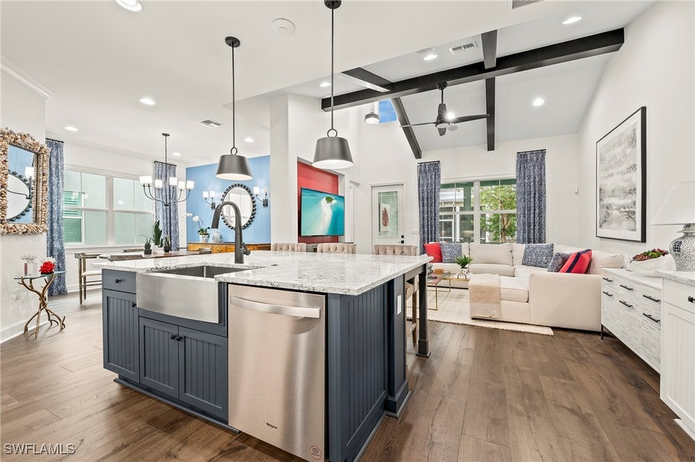 Kitchen with decorative light fixtures, stainless