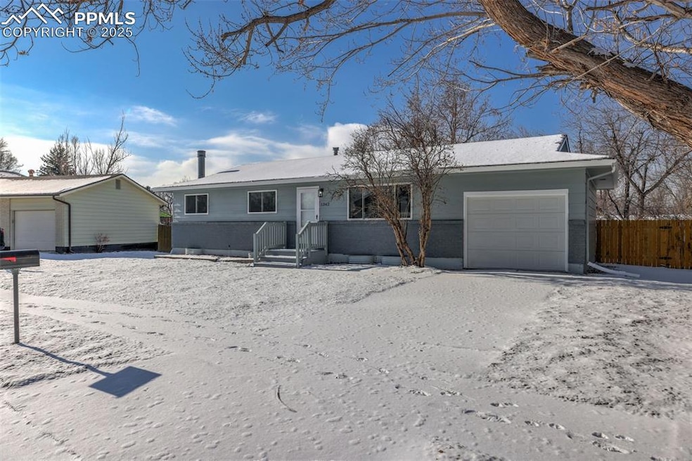 Single story home with a garage