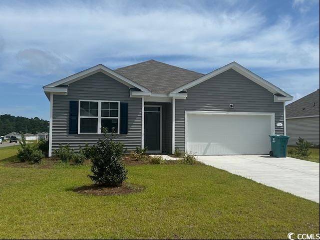 View of front of property with a garage and a fron