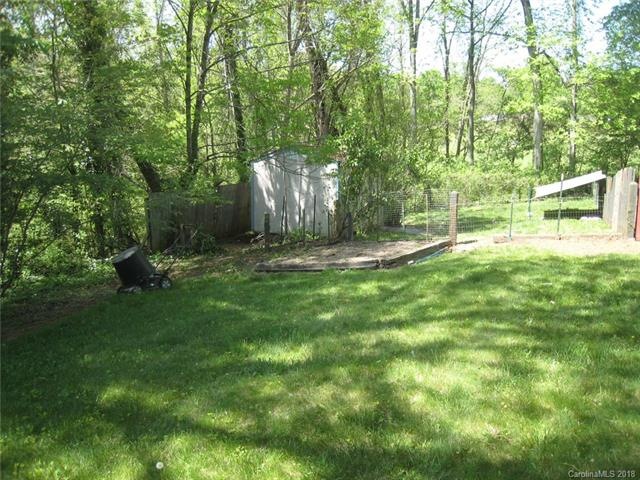 Great building site at street.  Lot goes beyond fencing, past the trees, to the park at the bottom of the hill.
