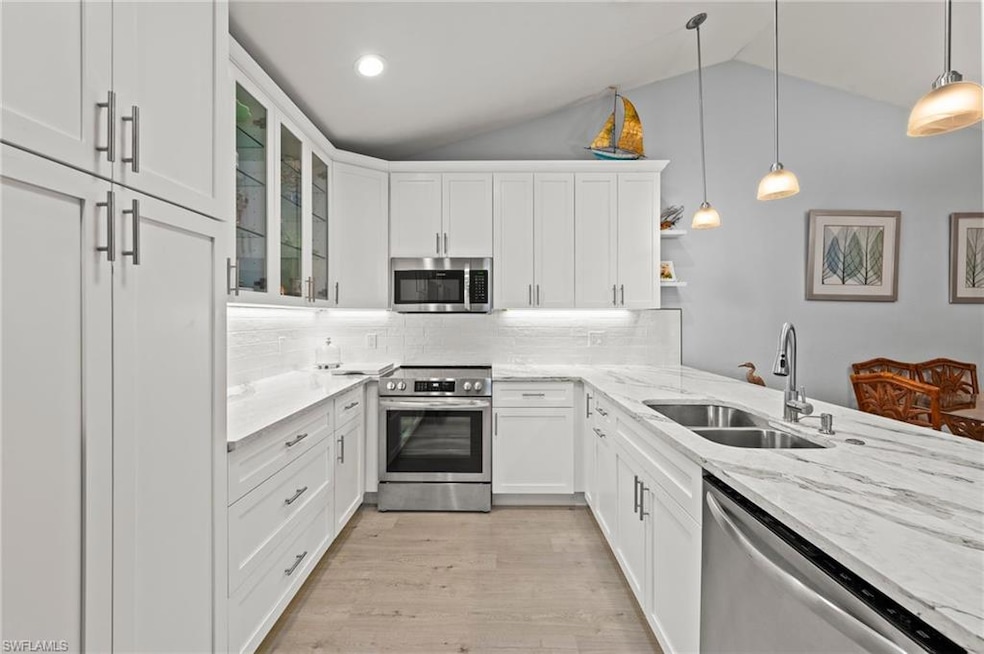 Kitchen featuring stainless steel appliances, loft