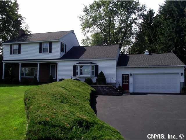 Exterior Front. Brick and vinyl siding, establishe