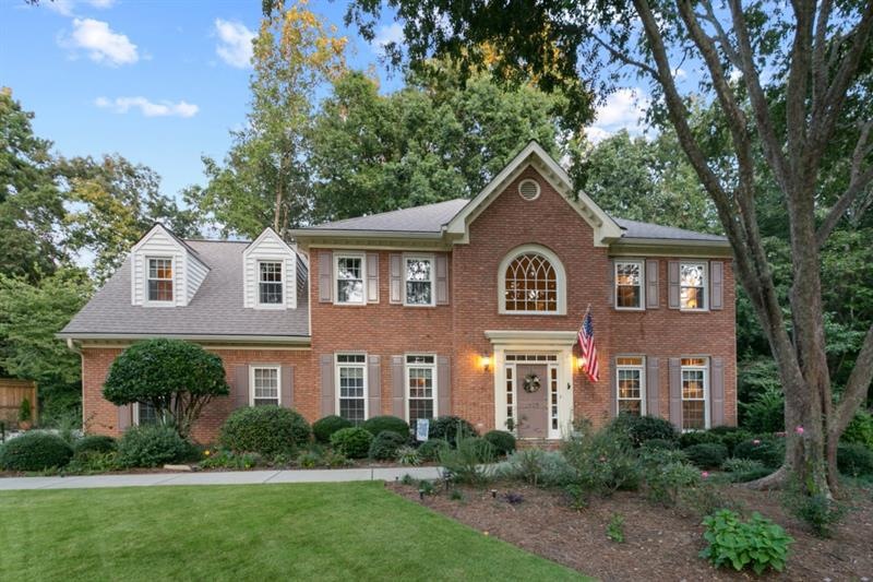 Welcome Home! Situated in a serene cul-de-sac surr