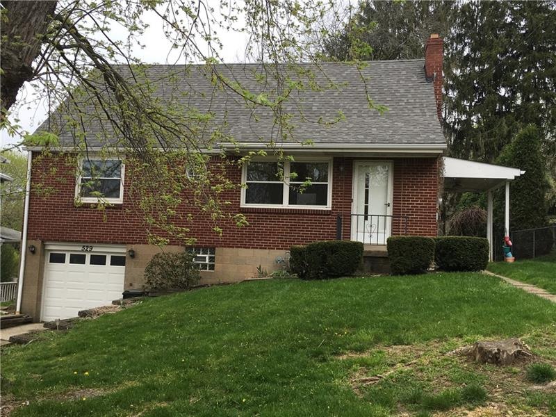 This four bedroom brick home has a large flat back