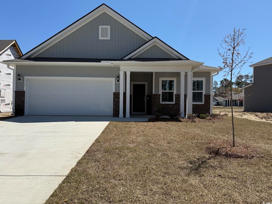 Craftsman inspired home with driveway, a garage, a