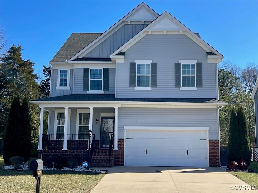 2 Story house with a garage and covered porch