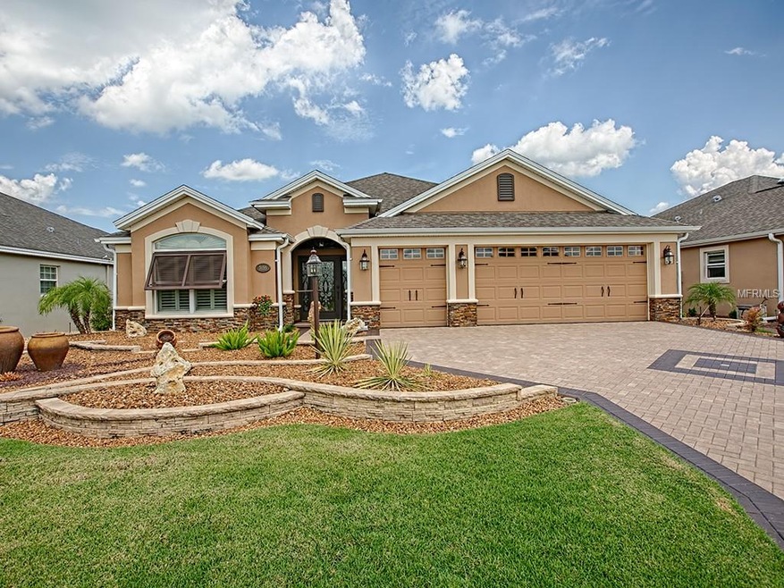 A beautiful stone entry and enhanced faade combine