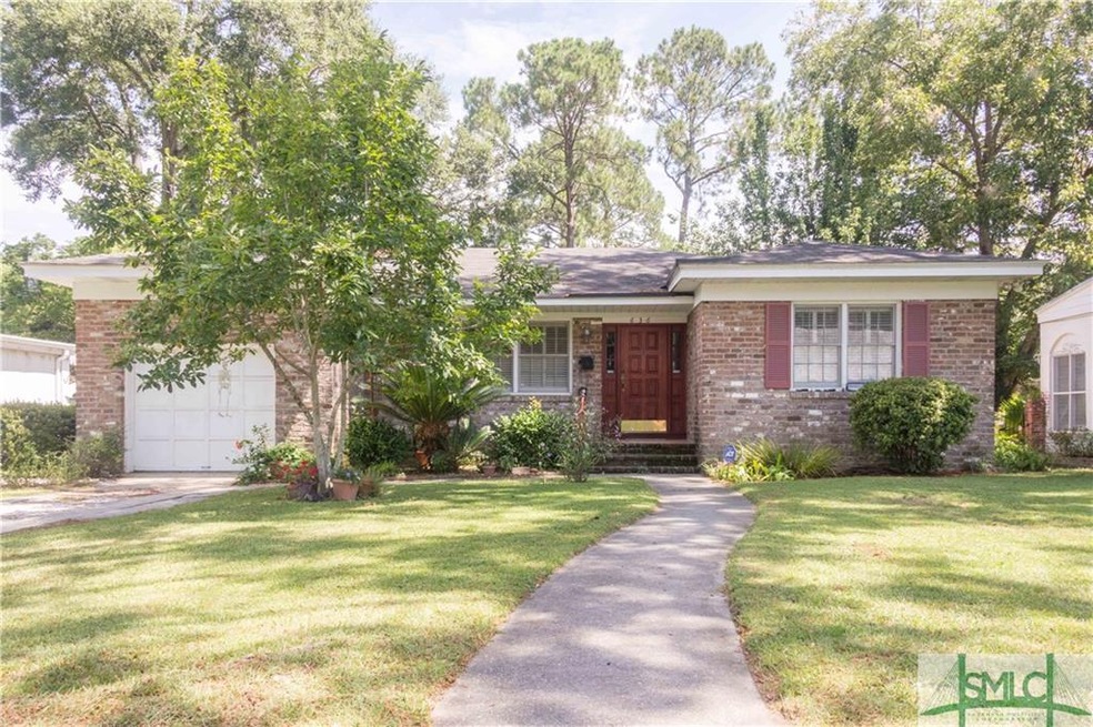 This handsome Ardsley Park brick bungalow has it a