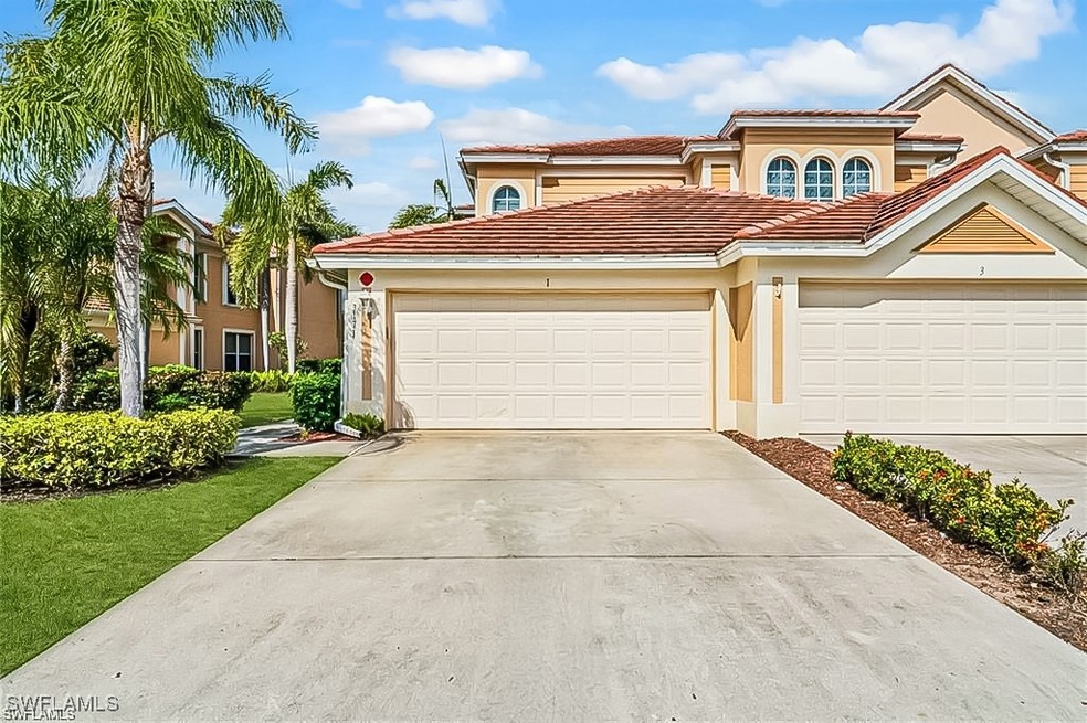 Mediterranean / spanish-style house featuring a ga