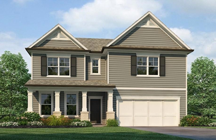 View of front of property featuring a garage and a