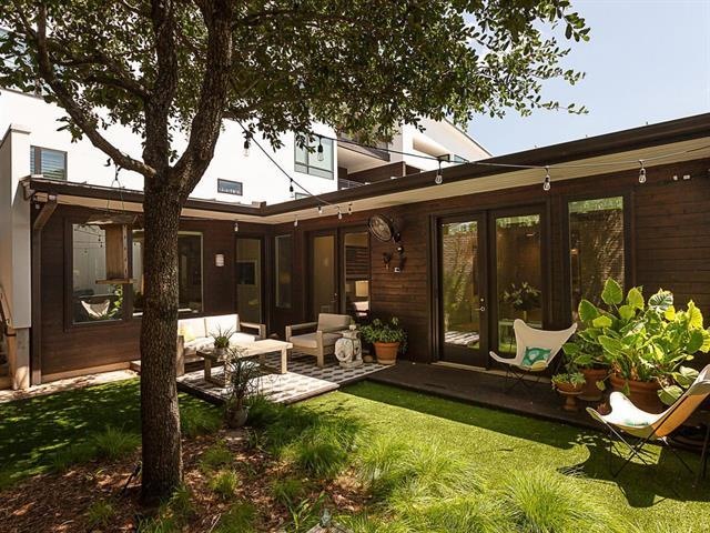 Private backyard sanctuary with turf and deck for 