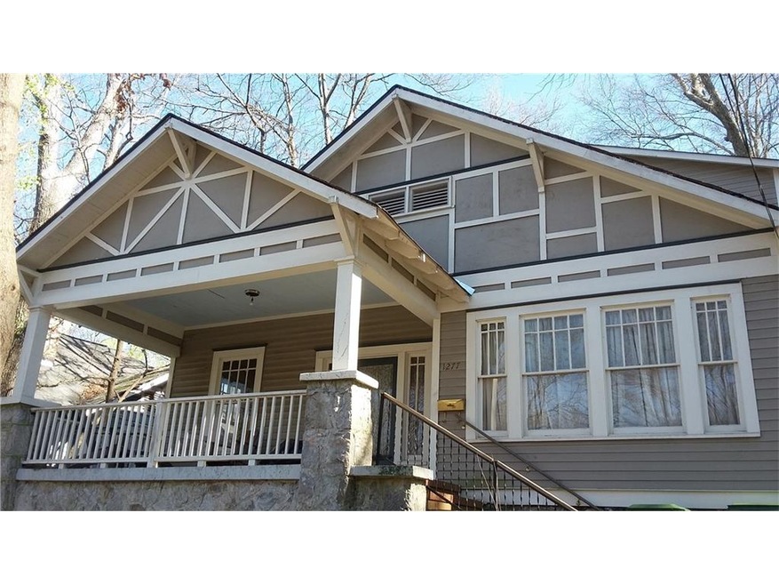 House has a great street presence. Front porch wit