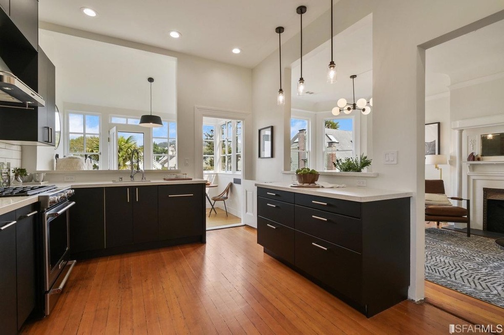 Updated open kitchen opens to living/dining and to