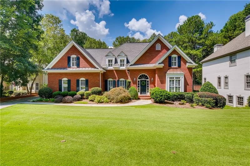 Stately home is situated on a manicured, level lot