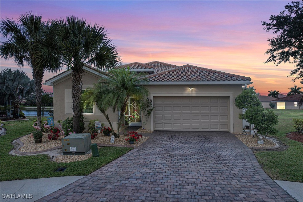 Single story home with stucco siding, a garage, a