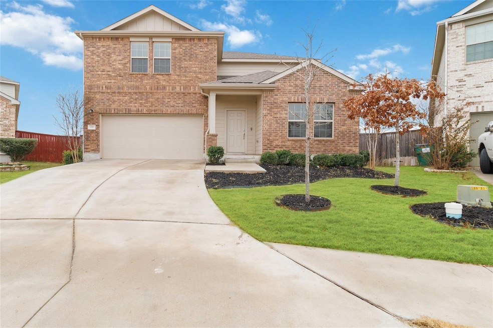 Traditional home with fence, an attached garage, 