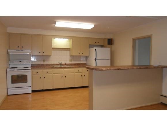 63 Pleasant St unit 2, Claremont, NH 03743 - photo 1