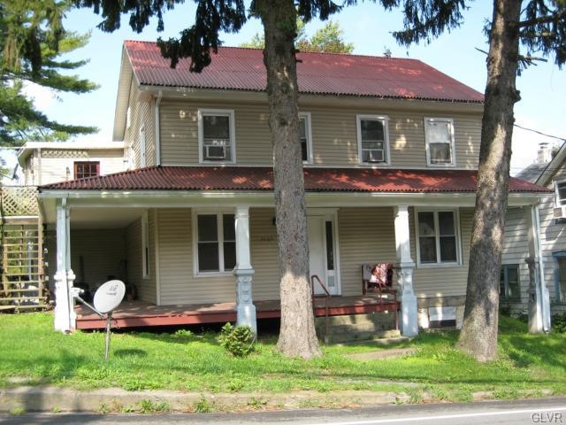 Front of house, apartment on first floor.
