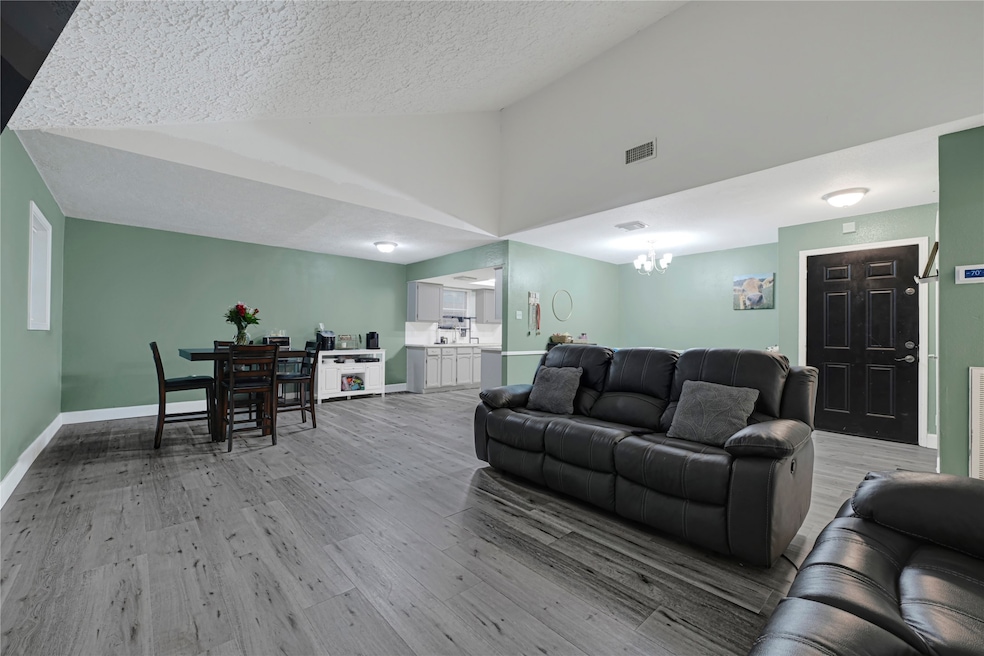 An angled view of the living room, breakfast area,