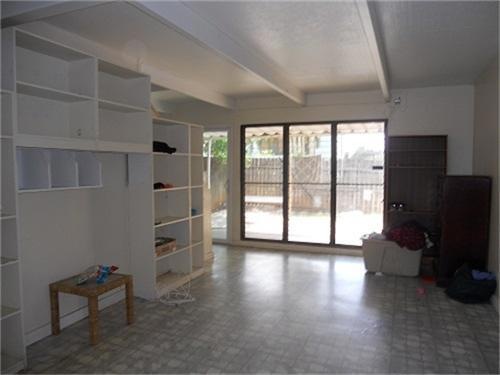 Living room with built in book cases and shelves.