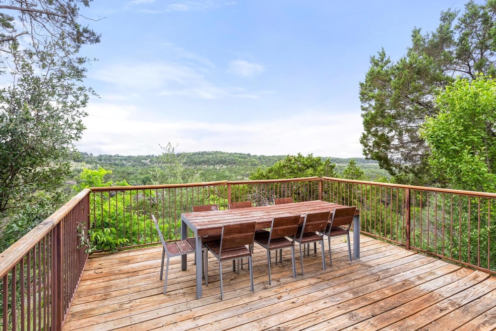 Wooden terrace featuring outdoor dining area and 