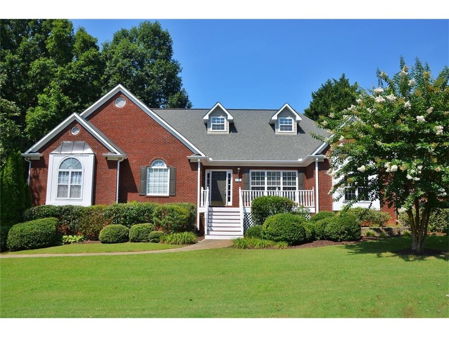 2 sided brick ranch on 3 car side entry garage.  R