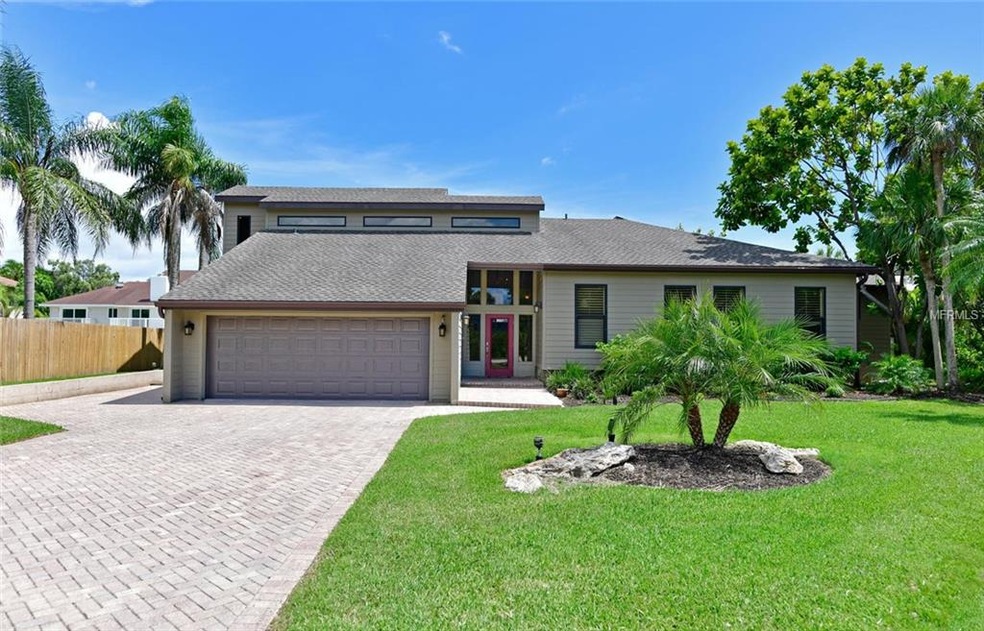Gorgeous curb appeal with mature landscaping, spac