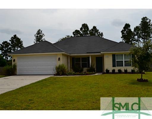 Exterior Front. Covered front porch and double-car