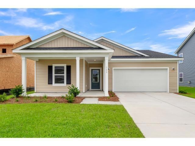 View of front of property featuring a garage and a