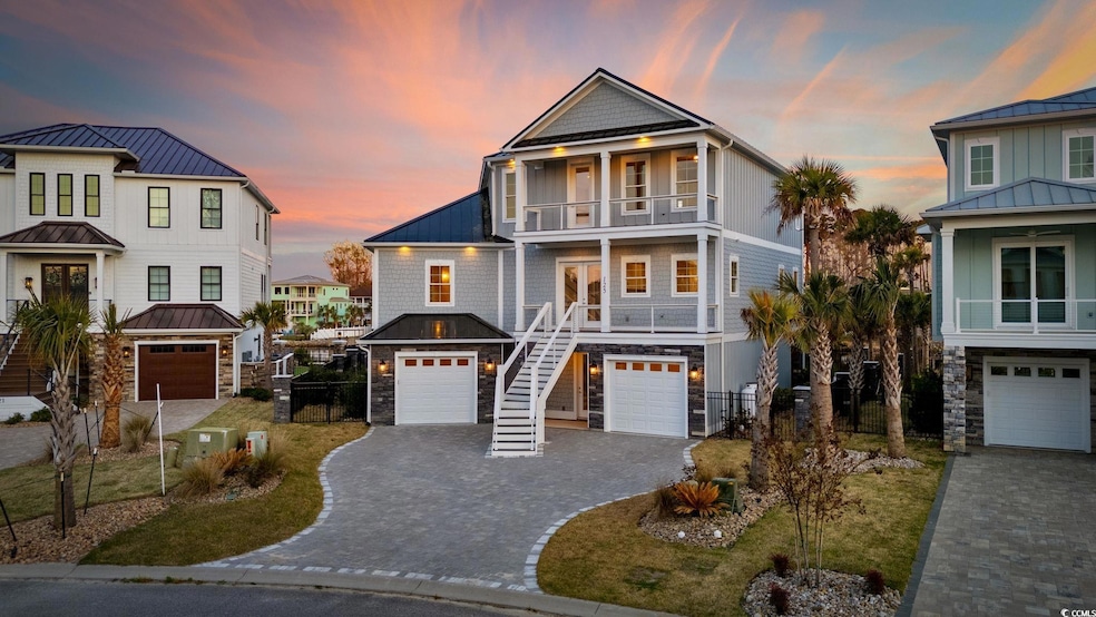 Raised beach house featuring stairway, decorative 