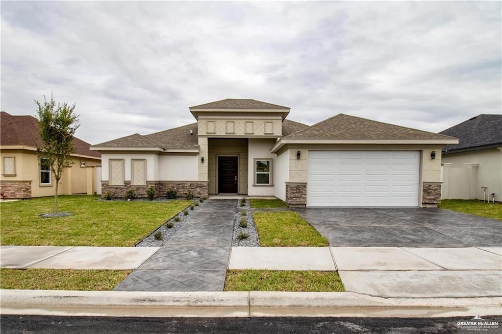 Prairie-style house with a shingled roof, driveway, stucco siding, a garage, and stone siding
