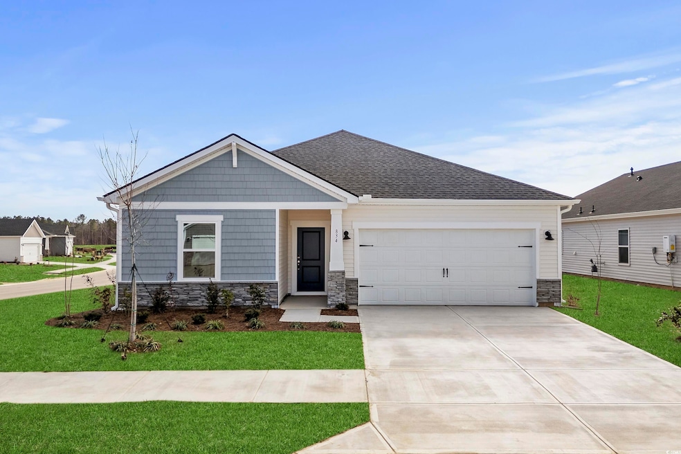 View of front of property with a garage and a fron