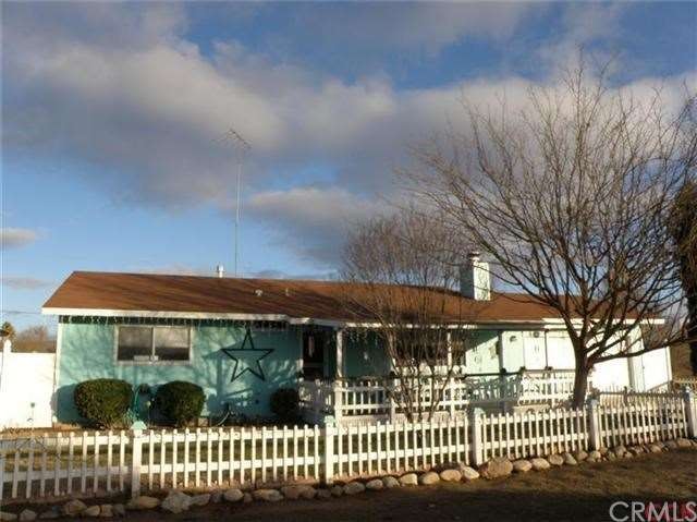 A nice home with picket fence and front porch. Rea