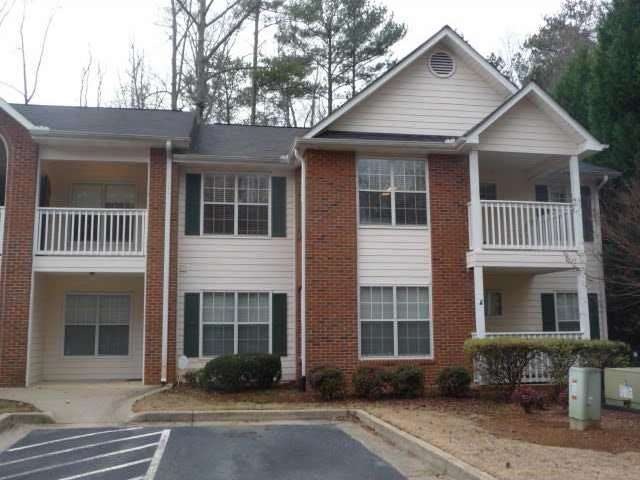 Exterior Front. End unit, top floor, 2 covered por