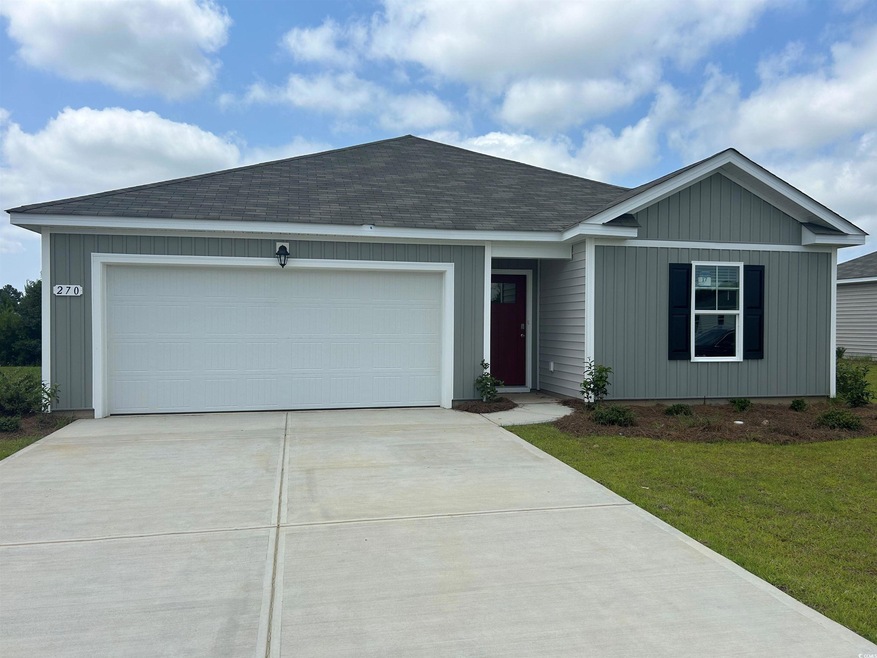 Ranch-style house featuring a garage and a front l