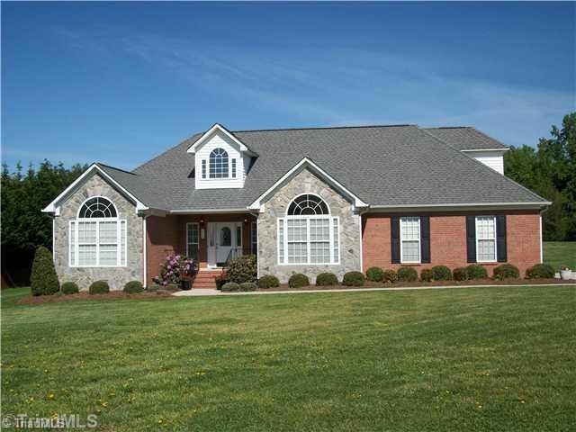 Exterior Front. Low maintenance brick and stone exterior.  Elegant covered front porch entry.
