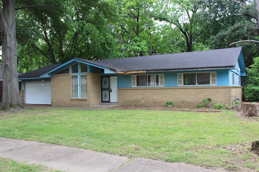 View of front of property featuring a garage, a fr