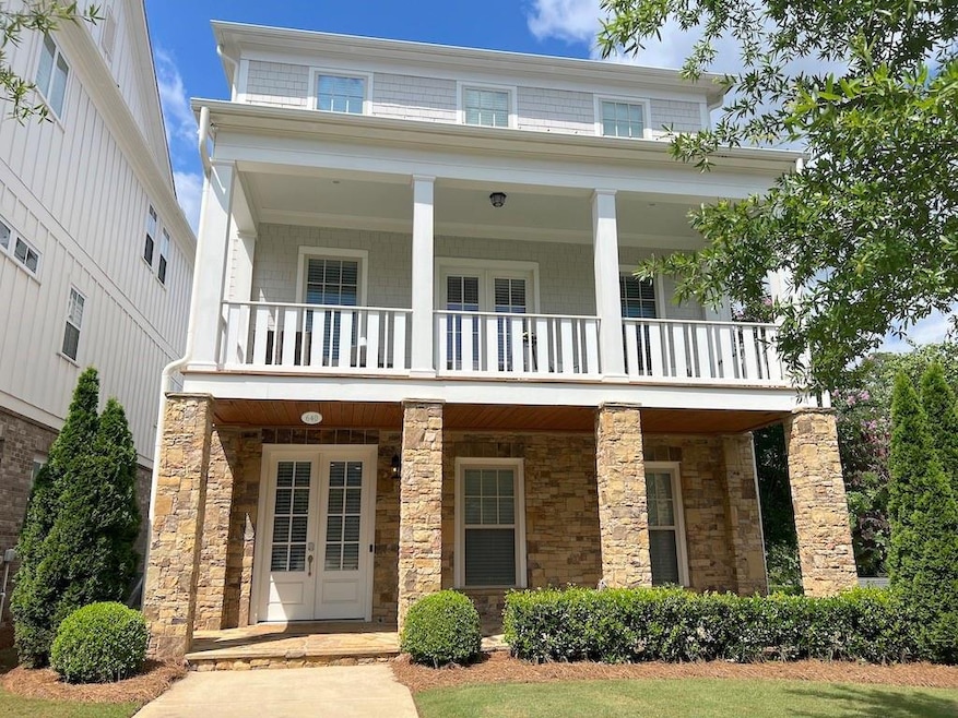 View of front of home with a balcony and a porch