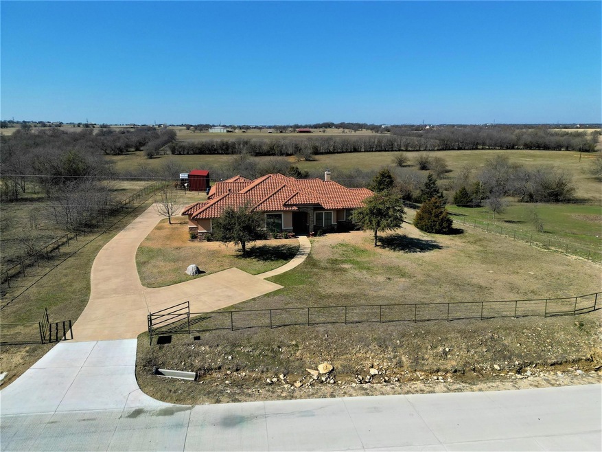 Welcome to the country! Gorgeous custom home sits high on a hill with spectacular views!