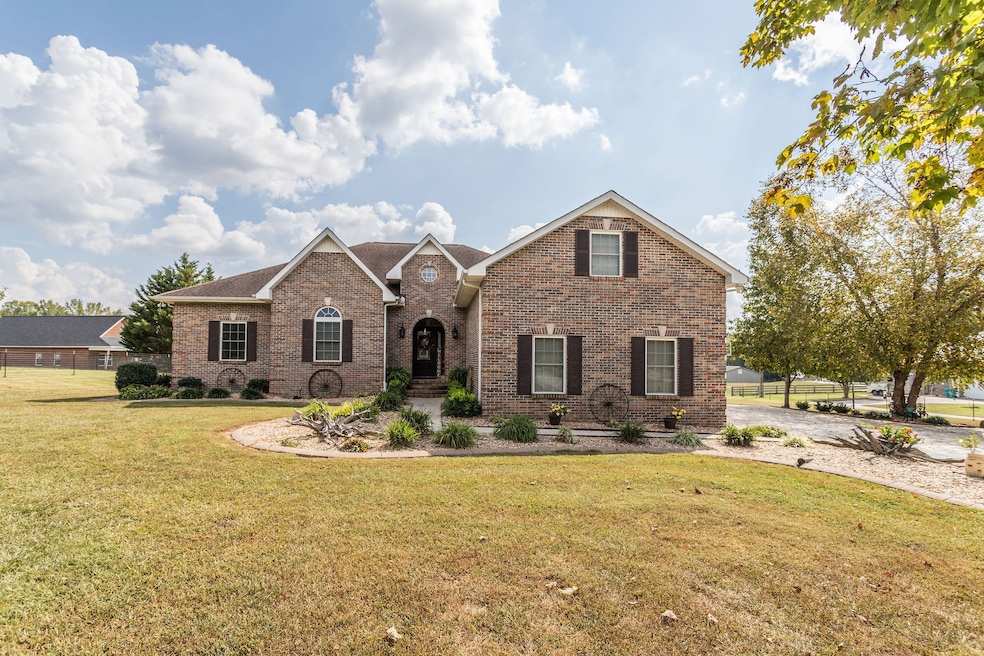 Stunning 3 BR/3 bath custom brick home with 5.04 acres!