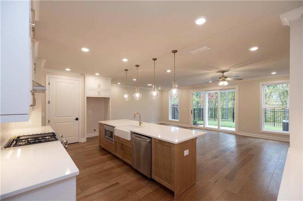Ward's Crossing by The Providence Group - in the Heart of Johns Creek - HOME is UNDER CONSTRUCTION with a SUMMER MOVE-IN. Photos are not of the home but of another Ellington Townhome in Ward's Crossing.
