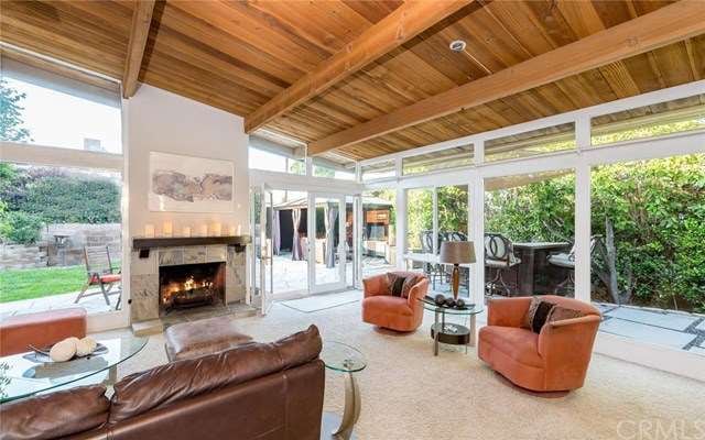 Vaulted ceilings and walls of glass create an indo