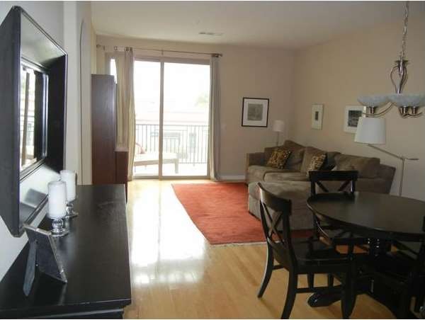 Custom hardwood floors and lots of natural light!