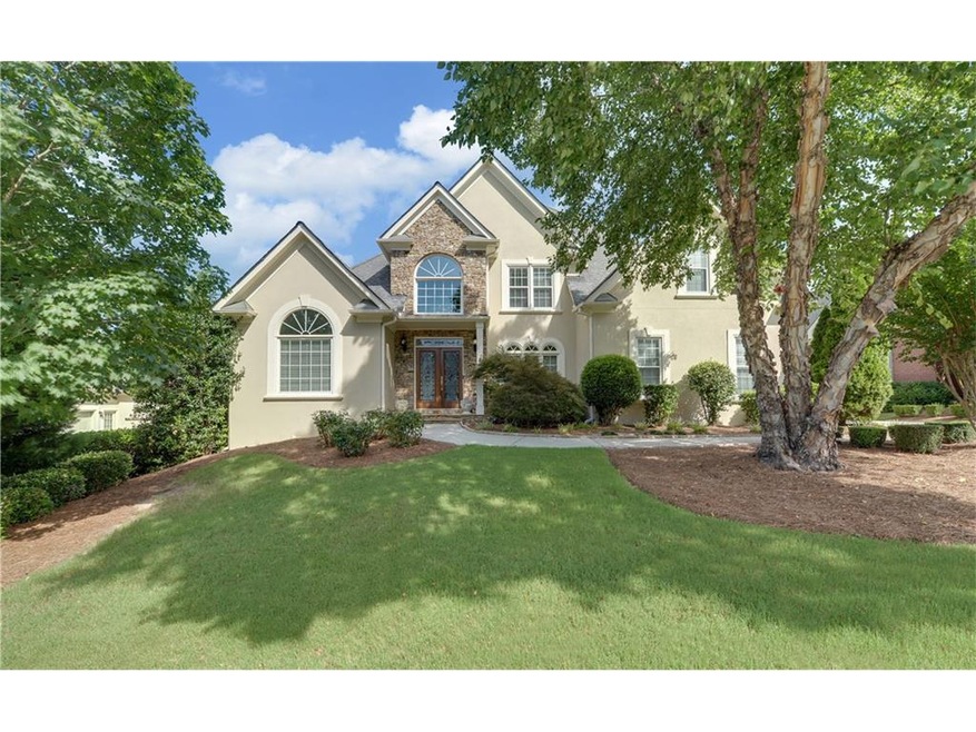 Hard coat stucco and stacked stone with beveled gl