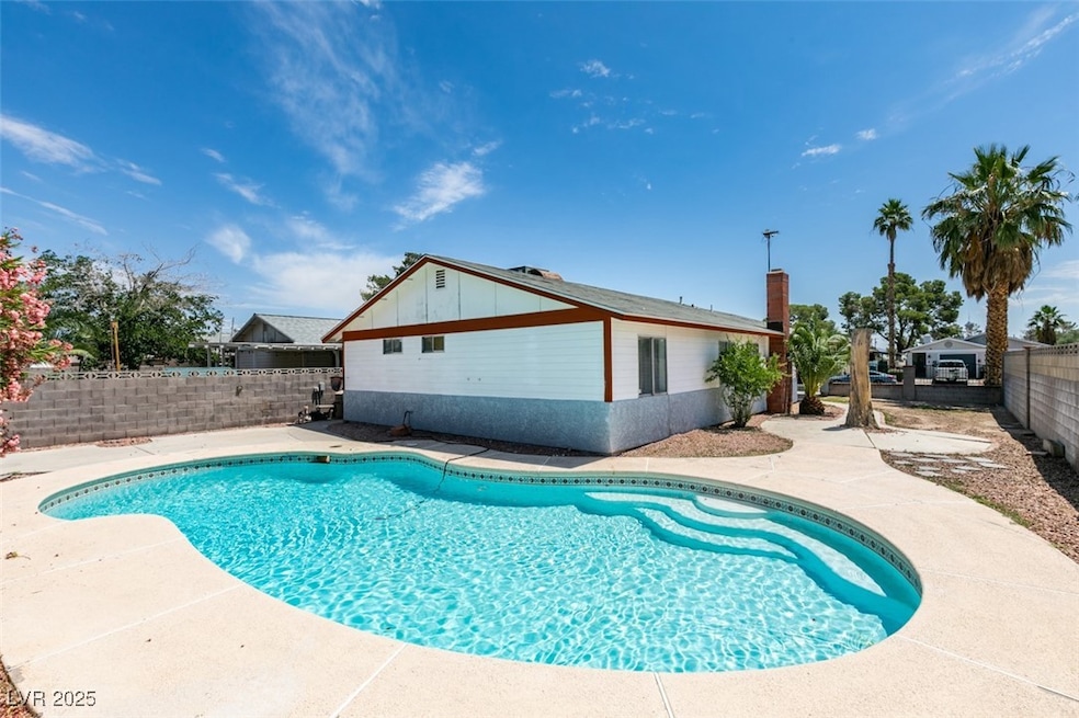 View of swimming pool featuring a fenced backyard