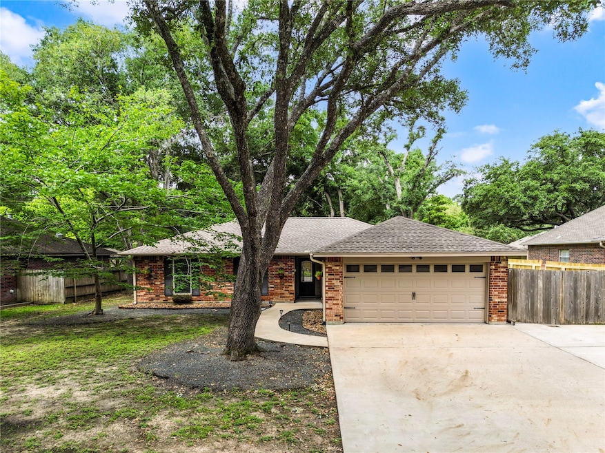 Beautiful canopy of trees surround the home.