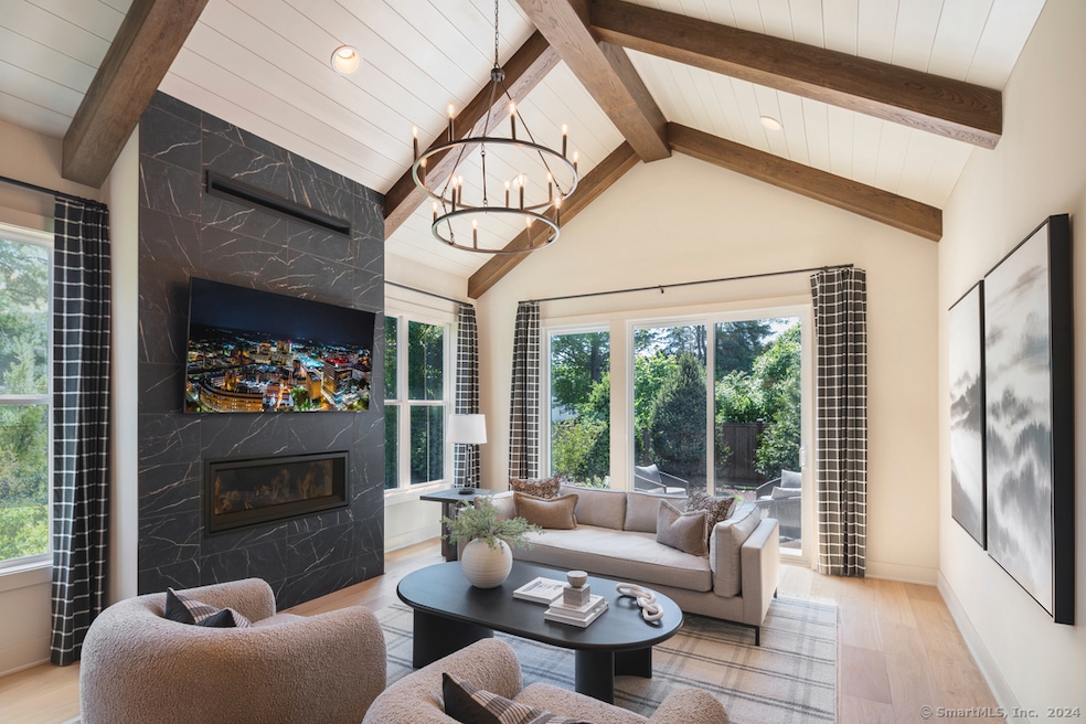 Great room with vaulted ceiling, linear fireplace,