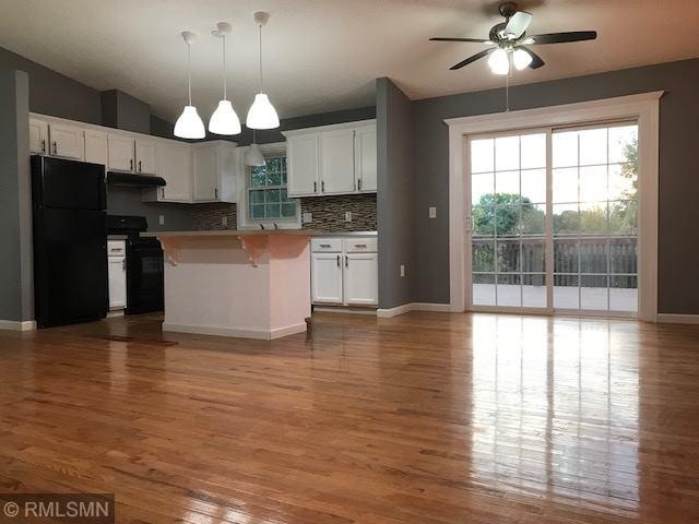 Open Kitchen Layout with Hardwood Floors