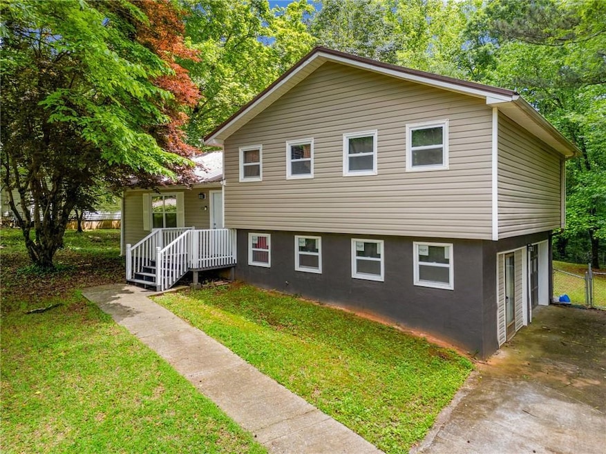 View of front of property with driveway, an attach